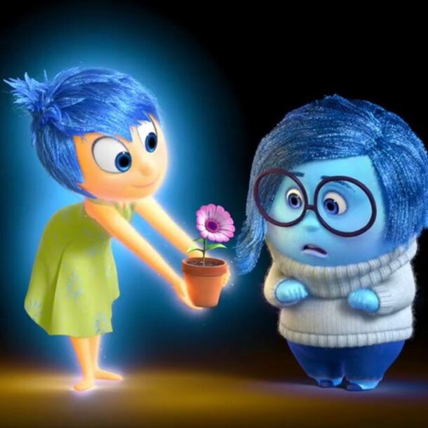 Joy from Inside Out offers a flower to Sadness