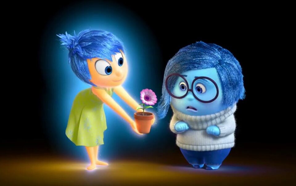 Joy from Inside Out offers a flower to Sadness